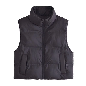 Women's black puffer vest with stand collar and quilted design for winter street style