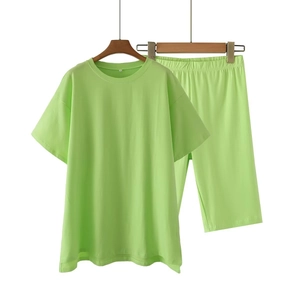 Bright green Y2K two-piece lounge set with short sleeve T-shirt and elastic shorts