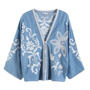 Vintage light blue blouse with delicate white floral embroidery and V-neckline style