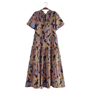 Bohemian floral printed tiered maxi dress with pleated neckline and tiered ruffle skirt