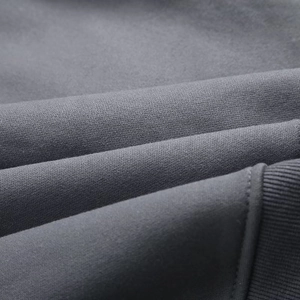 Detailed macro view of dark grey ribbed cuffs and thick knit fabric on Y2K sweatshirt