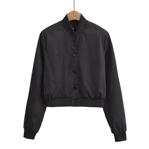 Detailed close-up of ribbed cuffs and collar on a black Y2K style bomber jacket