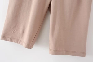Detailed close-up showing precision stitching and fabric texture of nude knit shorts