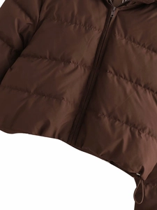 Detail view of winter padded coat showing matte quilted fabric, zipper and drawstring hem