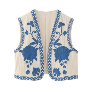 Ethnic style cream sleeveless vest featuring blue floral embroidery and a V-neck design