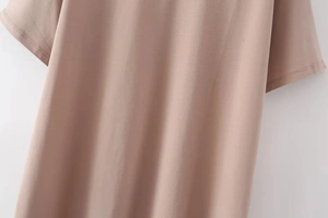 Detailed macro shot of premium cotton blend fabric texture on a mauve Y2K T-shirt neck