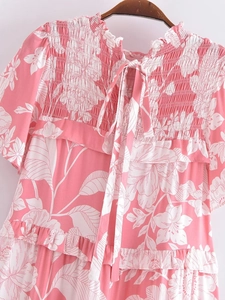 Detail of floral rayon smocked bodice and ruffled neckline with delicate back ties