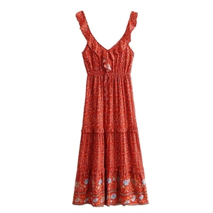 Detail of red floral maxi dress with ruffle straps, drawstring waist and layered hem