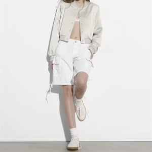 Y2K beige satin bomber jacket paired with white utility cargo shorts for women