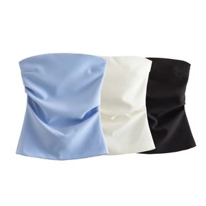 Flat lay of Y2K strapless tube tops in light blue, cream, and black with ruched satin fabric