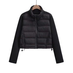 Close-up of black cropped jacket featuring stand collar and adjustable drawstring hem