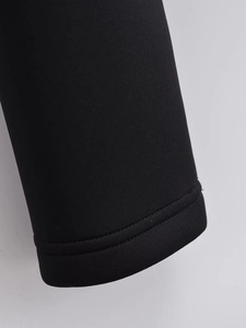 Close-up of black jacket cuff with professional double-needle flat stitching details