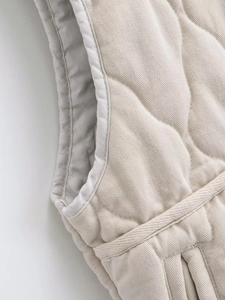 Detailed close-up of quilted vest seam and high-quality twill fabric texture