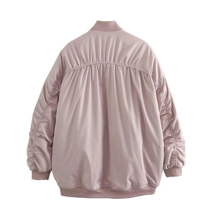 Detail view of pink Y2K bomber jacket featuring ruched back seams and ribbed cuffs