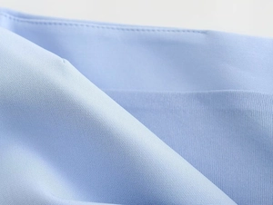Detailed close-up of light blue Y2K tube top showing seamless stitching and ribbed fabric