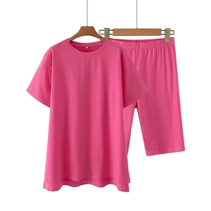 Women's Y2K two-piece set in rose pink with oversized T-shirt and cycling shorts
