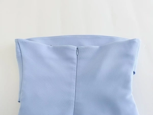 Detailed macro view of the light blue woven fabric with high-quality invisible zipper closure