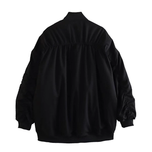 Detailed back view of a black Y2K bomber jacket featuring ruched texture and ribbed hem