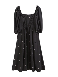 Women's black floral A-line dress with puff sleeves, square neck, and elastic waist