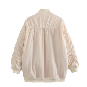 Back view of cream oversized Y2K bomber jacket with ruched sleeves and ribbed trim