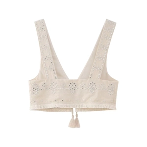 Detail of floral embroidery and sequins on cream ethnic vest with fringed hem