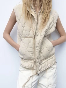 Women's Y2K quilted vest in off-white featuring a stand collar and zip closure