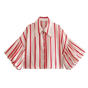 Detail of red and white striped satin shirt featuring voluminous lantern sleeves and collar