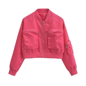 Detail view of rose pink bomber jacket featuring utility pockets and ribbed knit trims