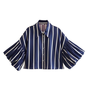 Detail of blue striped lantern sleeves and sharp collar on Y2K vintage style shirt