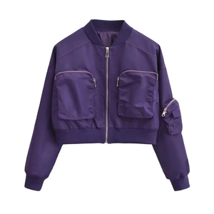 Close-up of purple bomber jacket with utility zipper pockets and ribbed trim details