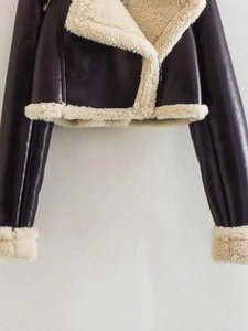 Detail of short dark purple PU leather jacket with plush cream fleece lining and collar
