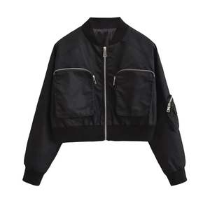 Detail view of a black Y2K cropped bomber jacket with functional utility zipper pockets
