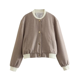 Detail of tan Y2K cropped jacket with ivory ribbed trim and gold snap buttons