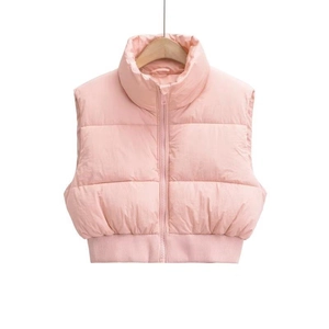 Detailed view of pink cropped puffer vest with stand collar and quilted texture