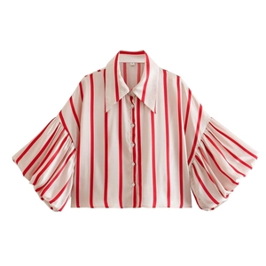 Detail of red and white striped shirt featuring oversized puff sleeves and classic pointed collar