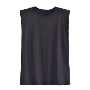 Detail of black cotton muscle tee showing wide padded shoulders and crew neck design