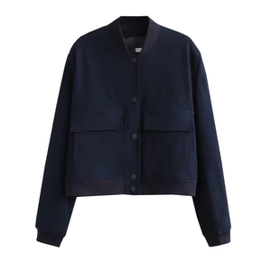 Detail of the navy blue bomber jacket with snap buttons and ribbed cuffs on white backdrop