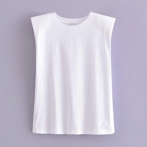 Detailed view of white round neck T-shirt featuring structured padded shoulders