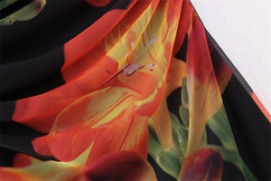 Close-up of semi-transparent mesh fabric with vibrant floral print and mesh texture