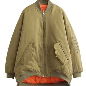 Army green oversized bomber jacket with orange quilted lining and utility arm pocket