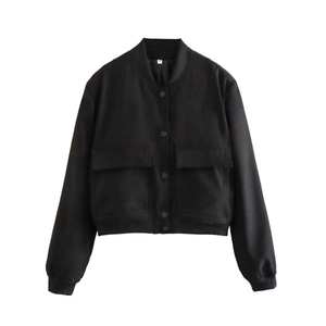 Detail of black Y2K bomber jacket featuring snap buttons and large symmetrical chest pockets