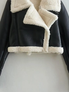 Detail of Y2K cropped biker jacket with black PU leather and cream faux shearling lapel