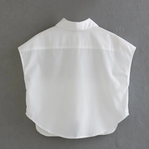 Rear view of white button-down short shirt with lapel collar and curved hemline