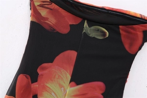 Detailed macro view of Y2K vintage floral print on breathable black mesh fabric