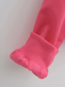 Detailed macro shot of the pink Y2K bomber jacket sleeve with ribbed knit cuff detail