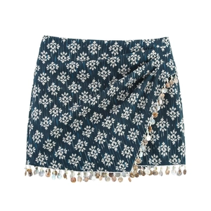 Detailed view of Y2K high waist skirt with floral print and beaded seashell tassel fringe