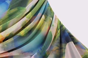 Detail of sheer mesh fabric with abstract floral print and layered pleated design
