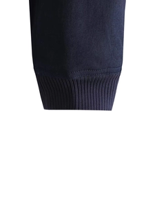Detail of the elastic ribbed cuffs on this dark blue Y2K style bomber flight jacket
