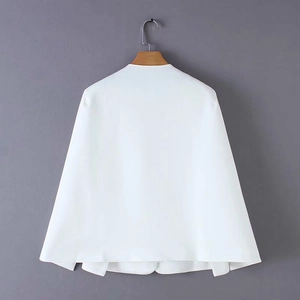 Detail view of white Y2K style cape blazer showing structured A-line back and split design
