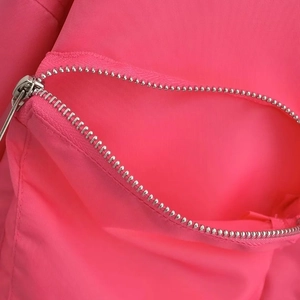 Bright pink Y2K style bomber jacket featuring a high-quality silver metal zipper detail